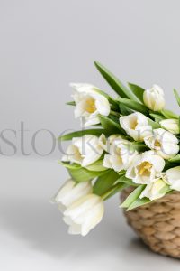 Vertical stock photo of flowers in basket