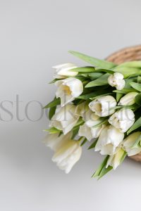 Vertical stock photo of flowers in basket