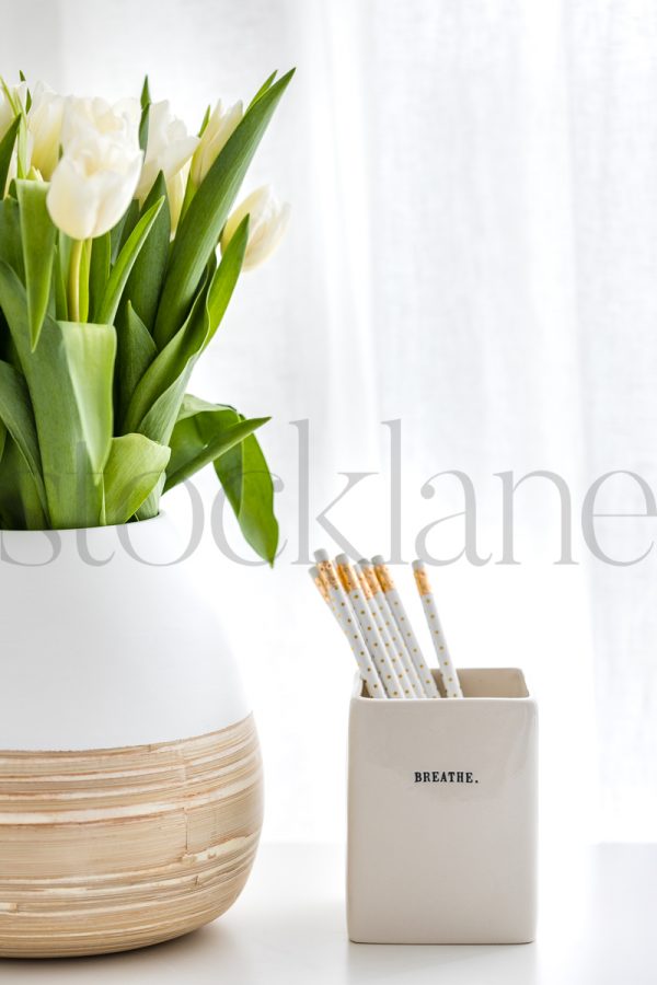 Vertical stock photo of pencils and flowers