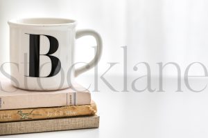 Horizontal stock photo of coffee cup and books