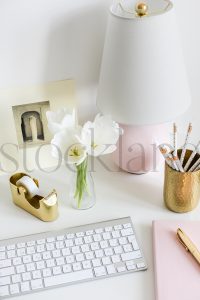 Vertical stock photo of feminine desktop