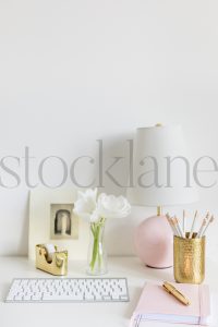 Vertical stock photo of feminine desktop