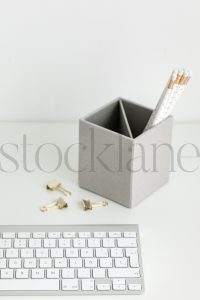 Vertical stock photo of feminine desktop