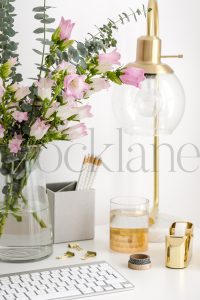 Vertical stock photo of feminine desktop