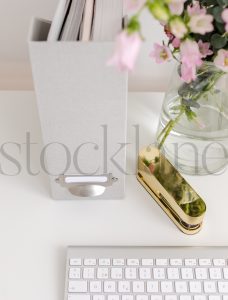 Vertical stock photo of feminine desktop