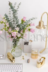 Vertical stock photo of feminine desktop