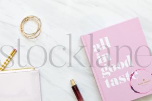 Vertical stock photo of feminine desktop