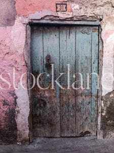 Vertical stock photo of a rustic door