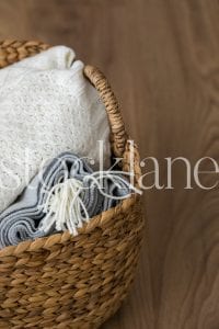 Vertical stock photo of blankets in basket