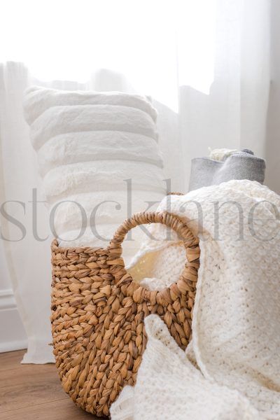 Vertical stock photo of basket with blankets