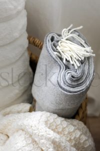Vertical stock photo of blankets in basket
