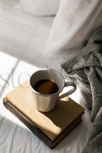 Vertical stock photo of coffee and books