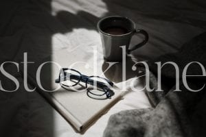 Horizontal stock photo of book and glasses