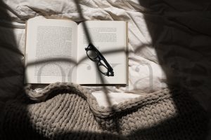 Horizontal stock photo of book and glasses