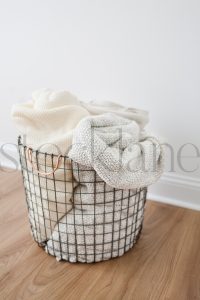 Vertical stock photo of basket with blankets