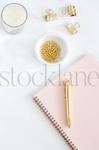 Vertical stock photo of feminine desktop