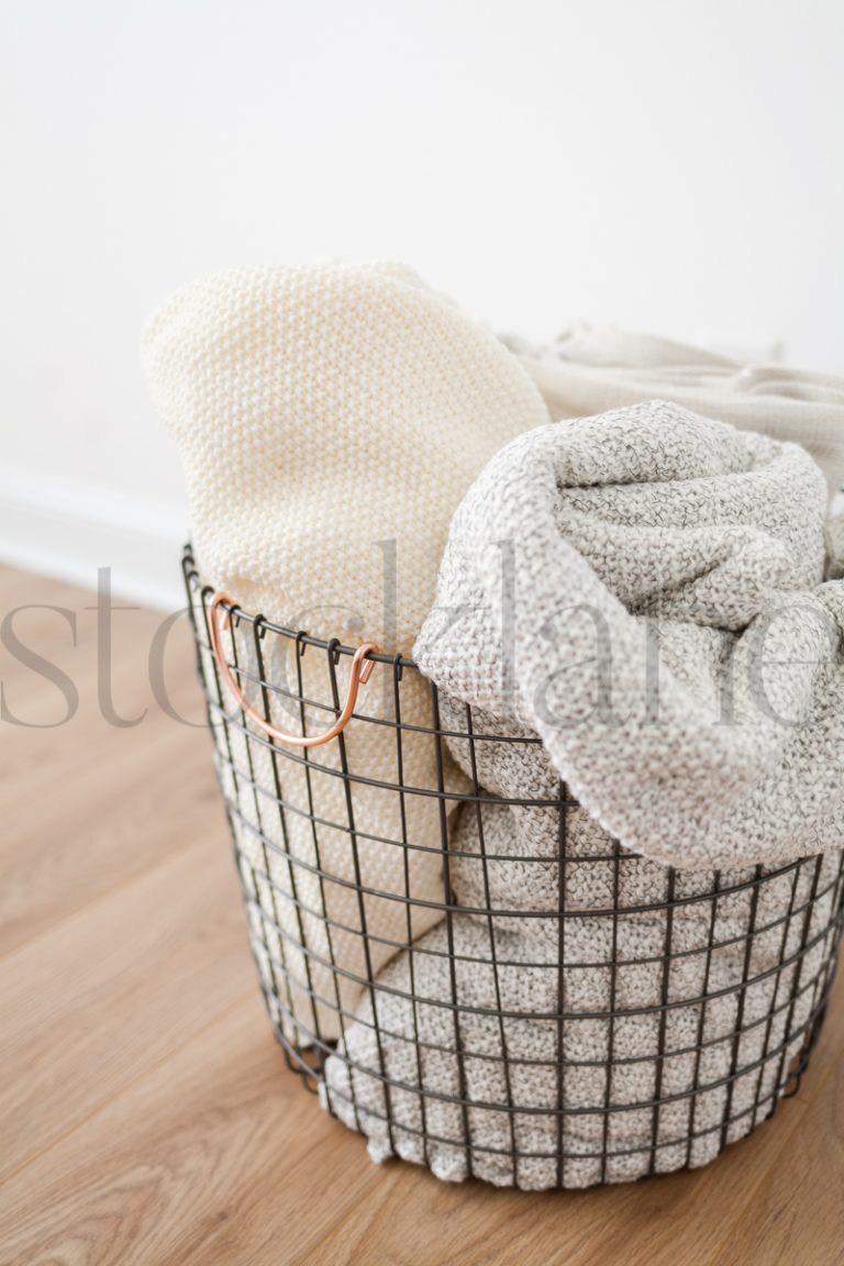 Vertical stock photo of basket with blankets