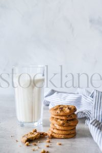 Vertical stock photo of milk and cookies