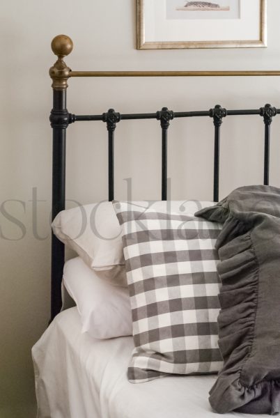 Vertical stoke photo of bed and headboard