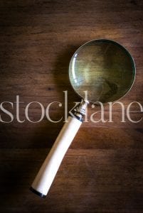 Vertical Stock photo of vintage magnifying glass