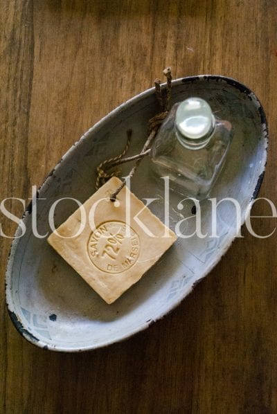 Vertical stock photo of a bar of soap and dish