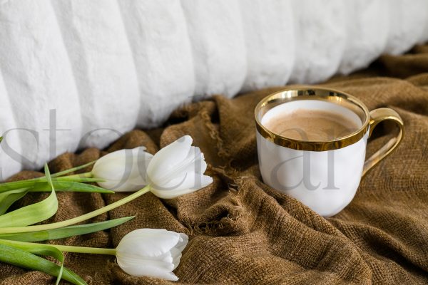 Horizontal stock photo of coffee cup and tulips