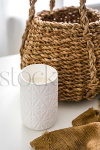 Vertical stock photo of candle and basket