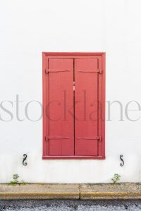 Vertical stock photo of red shutters