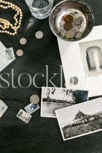 Vertical stock photo of coins and stamps