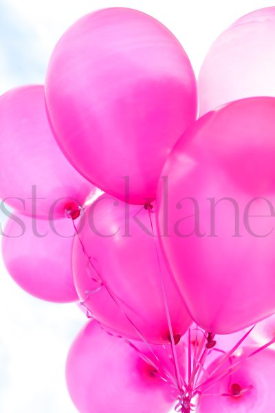 Vertical stock photo of pink balloons