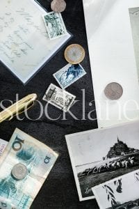 Vertical stock photo of coins and stamps