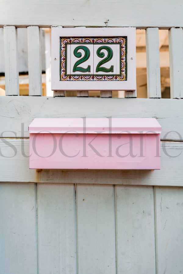 Vertical stock photo of pink mailbox