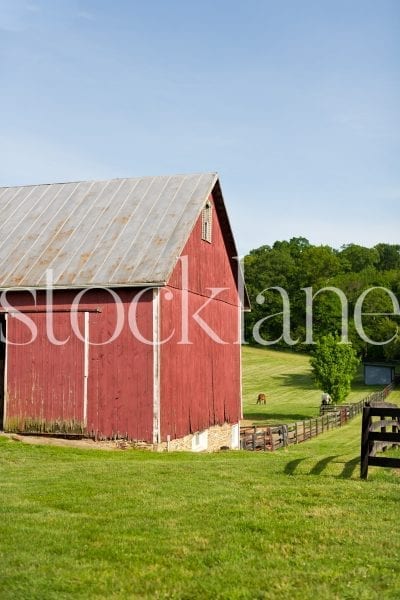 Vertical stock photo of red barn