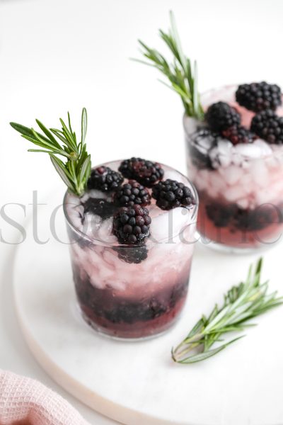 Vertical stock photo of blackberry drinks