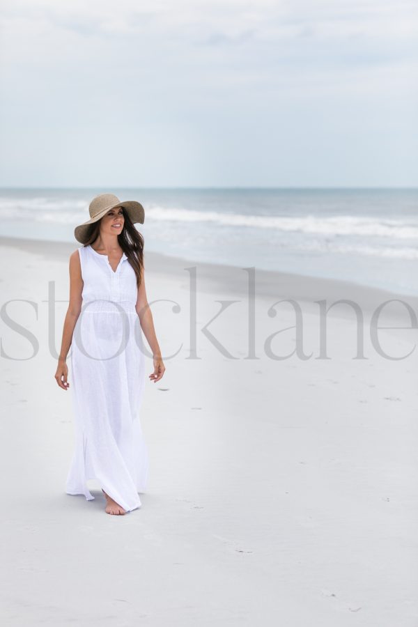 Vertical stock photo of woman at the beach