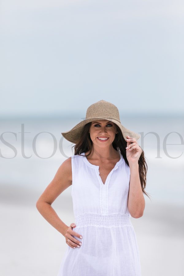 Vertical stock photo of woman at the beach