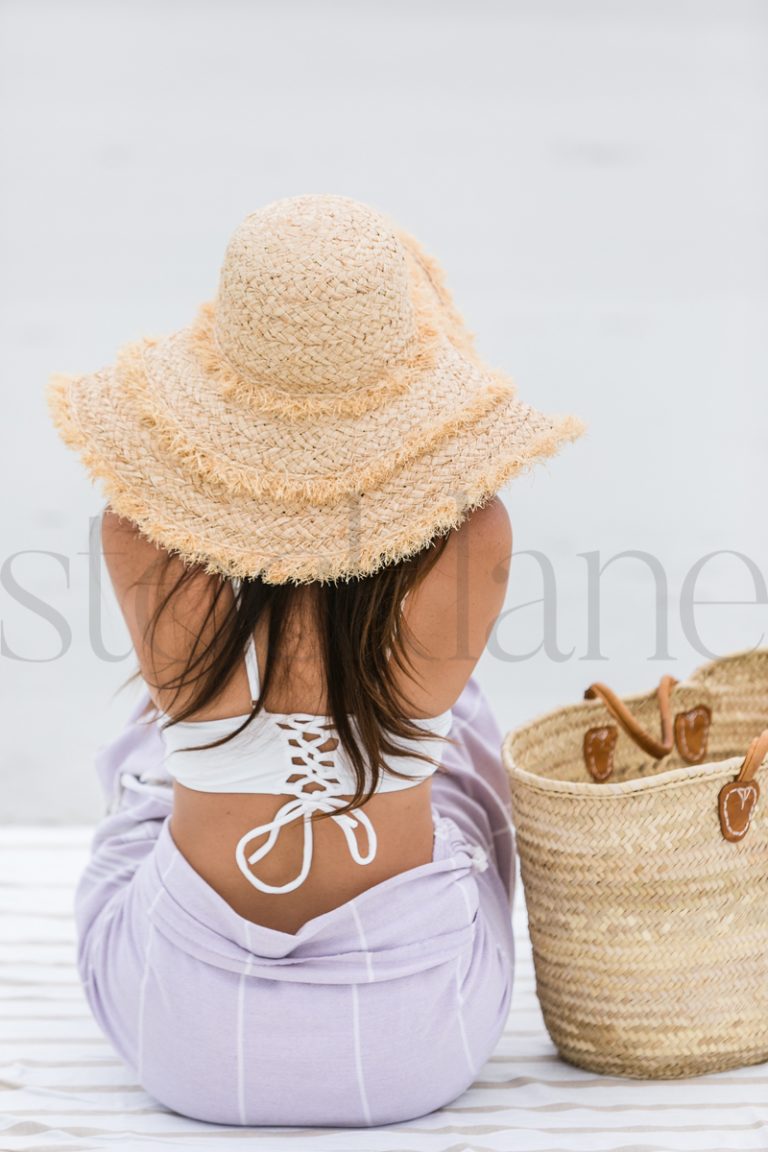 Vertical stock photo of woman at the beach