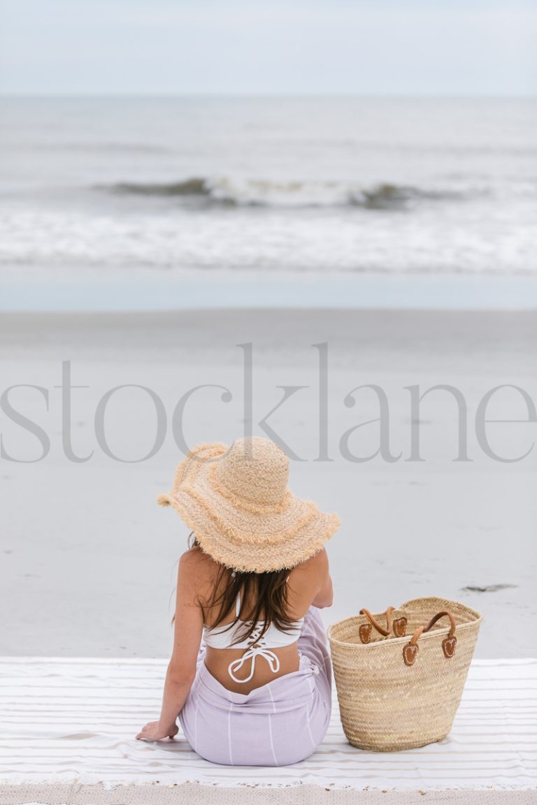 Vertical stock photo of woman at the beach