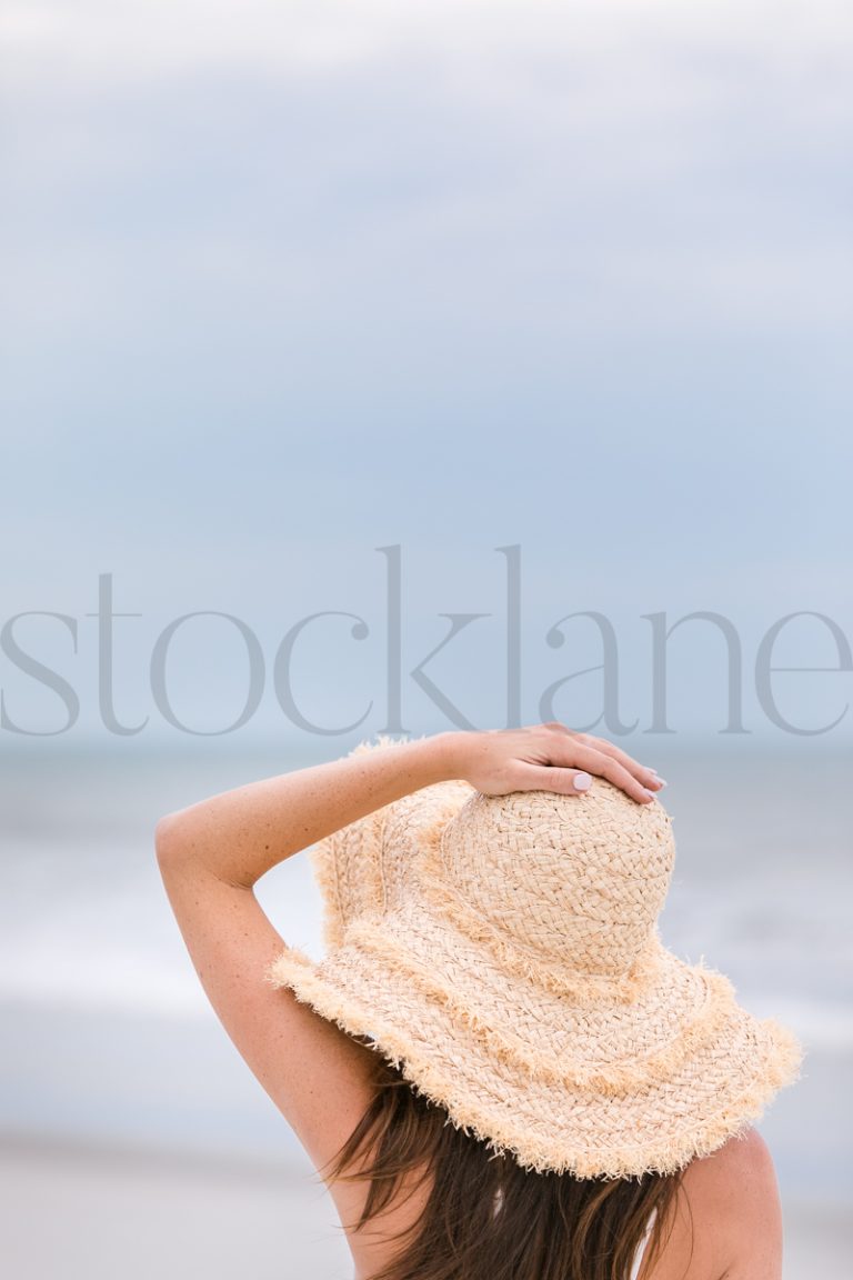 Vertical stock photo of woman at the beach