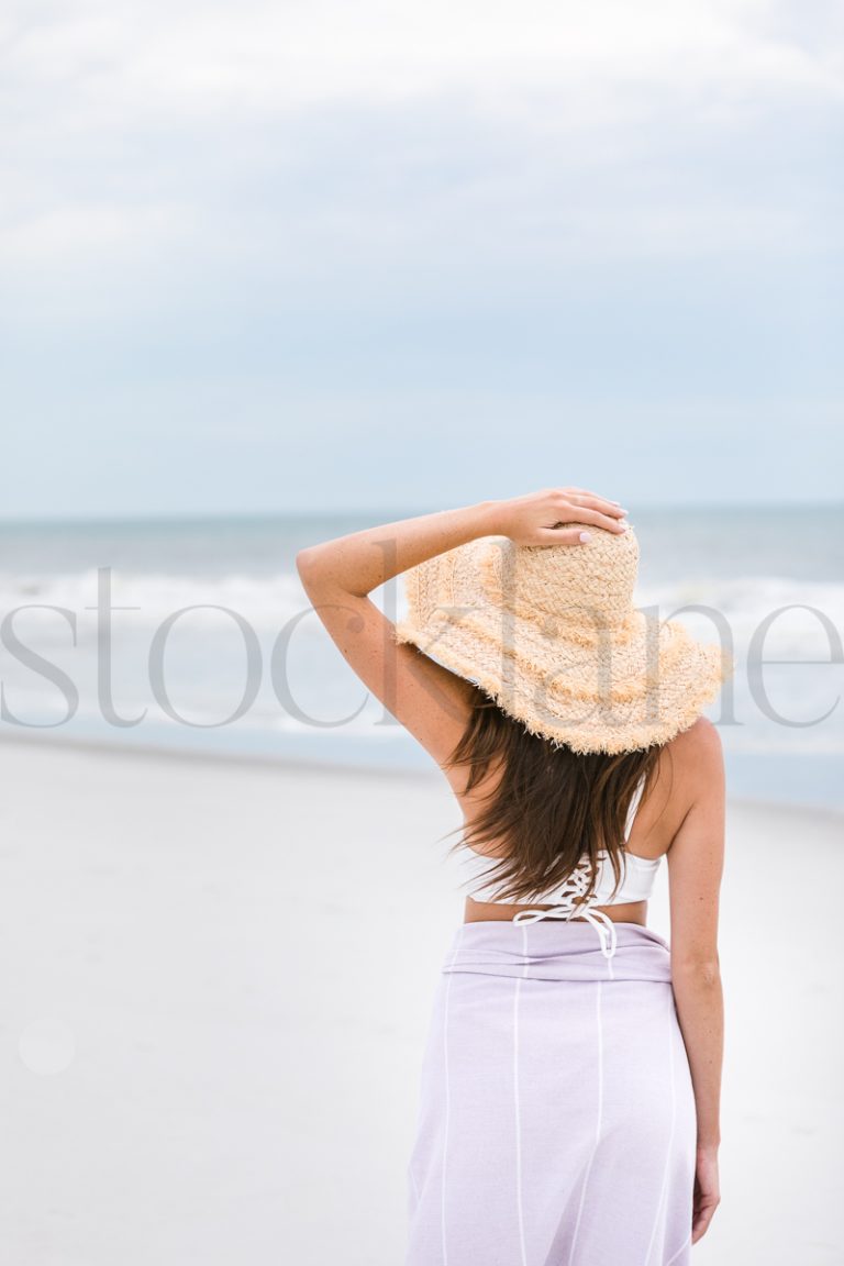 Vertical stock photo of woman at the beach