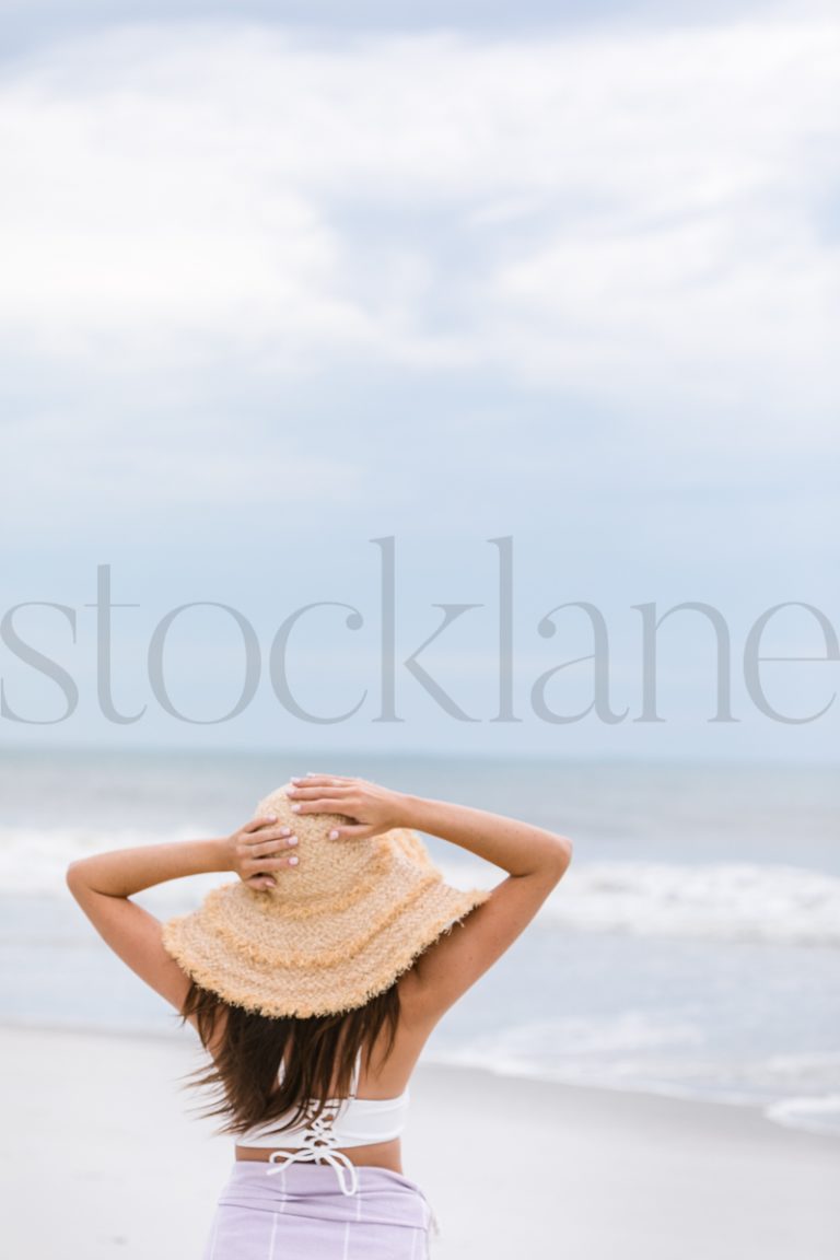 Vertical stock photo of woman at the beach