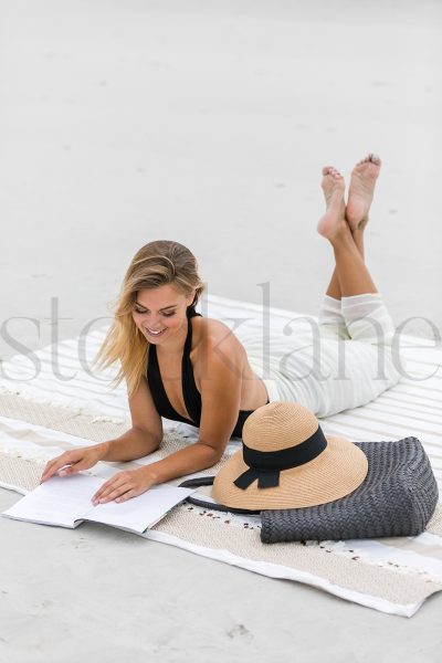 Vertical stock photo of woman at the beach