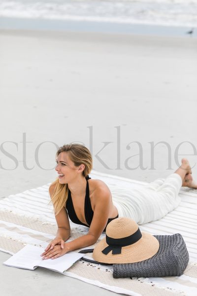 Vertical stock photo of woman at the beach