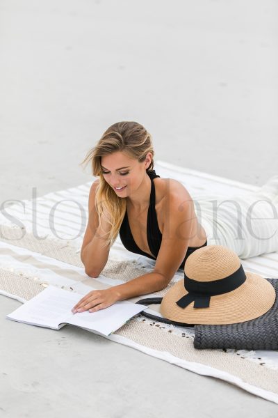 Vertical stock photo of woman at the beach