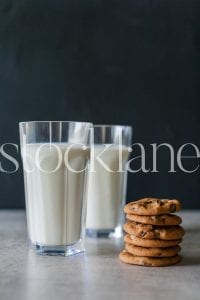 Vertical stock photo of milk and cookies