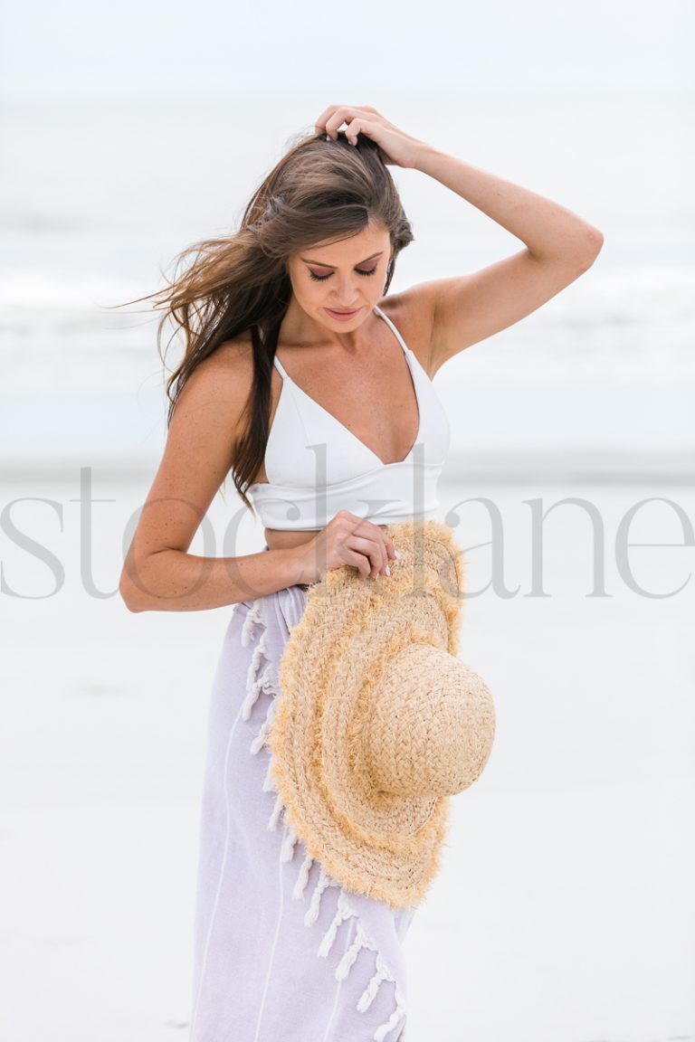 Vertical stock photo of woman at the beach