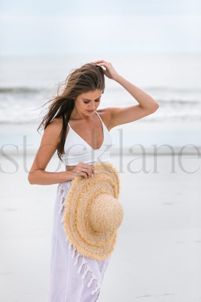 Vertical stock photo of woman at the beach