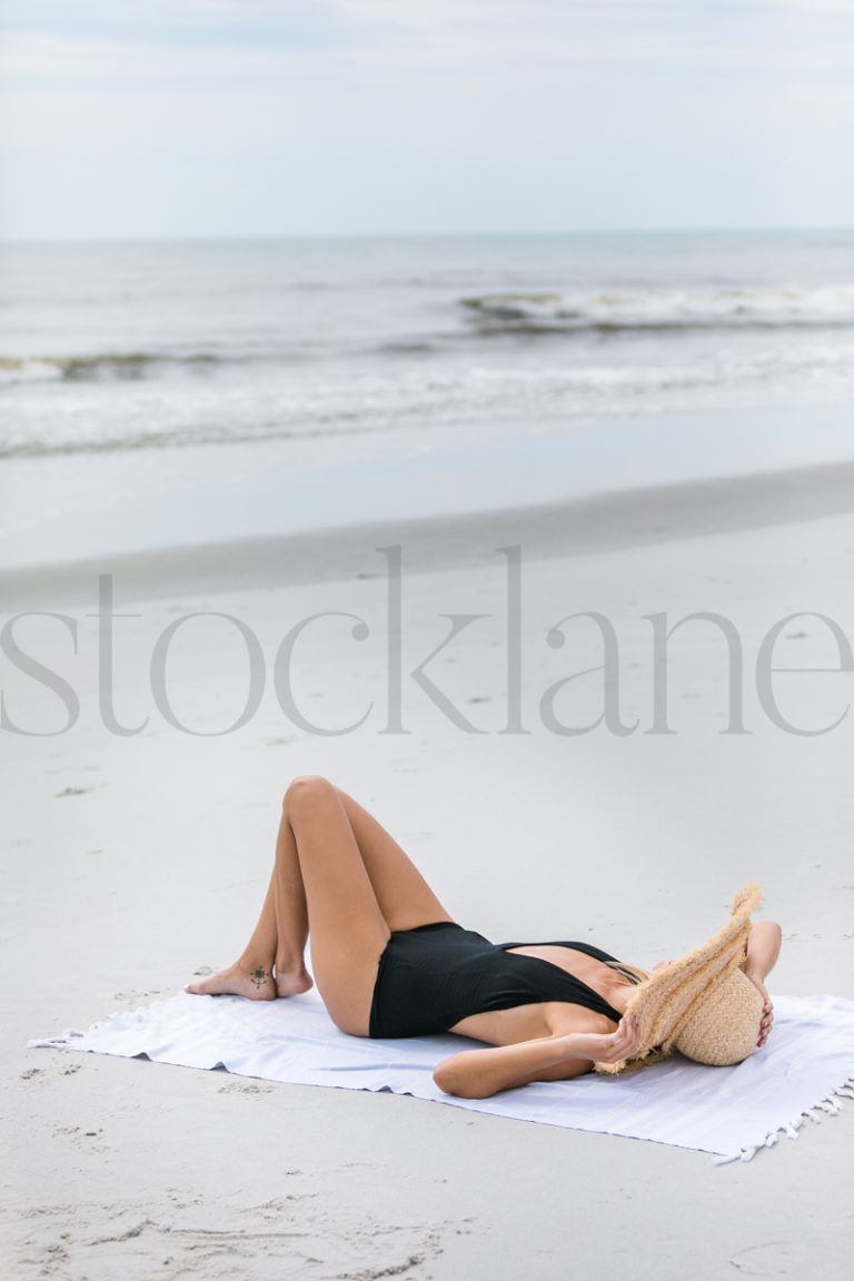 Vertical stock photo of woman at the beach