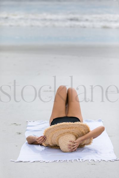 Vertical stock photo of woman at the beach