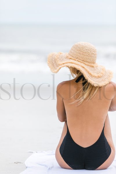 Vertical stock photo of woman at the beach